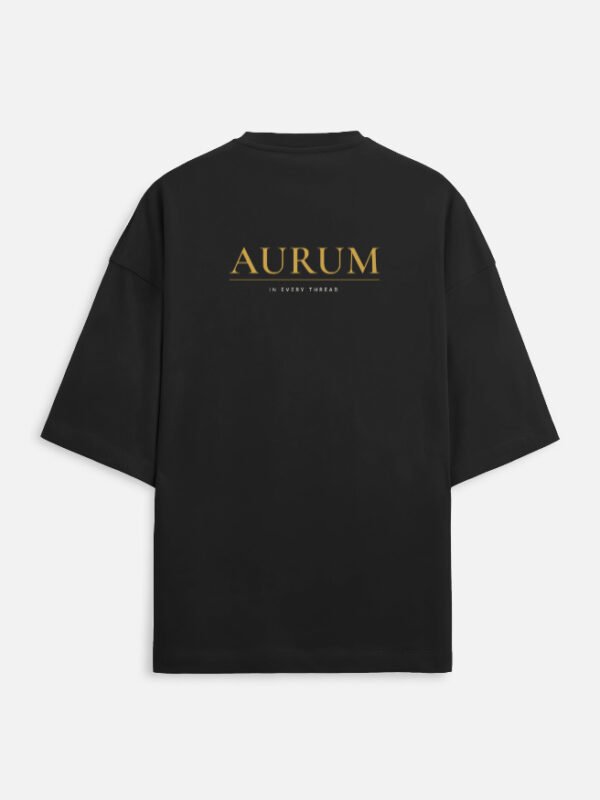 AURUM — Terry Oversized Tee in black, back view with the Au element tile and AURUM wordmark