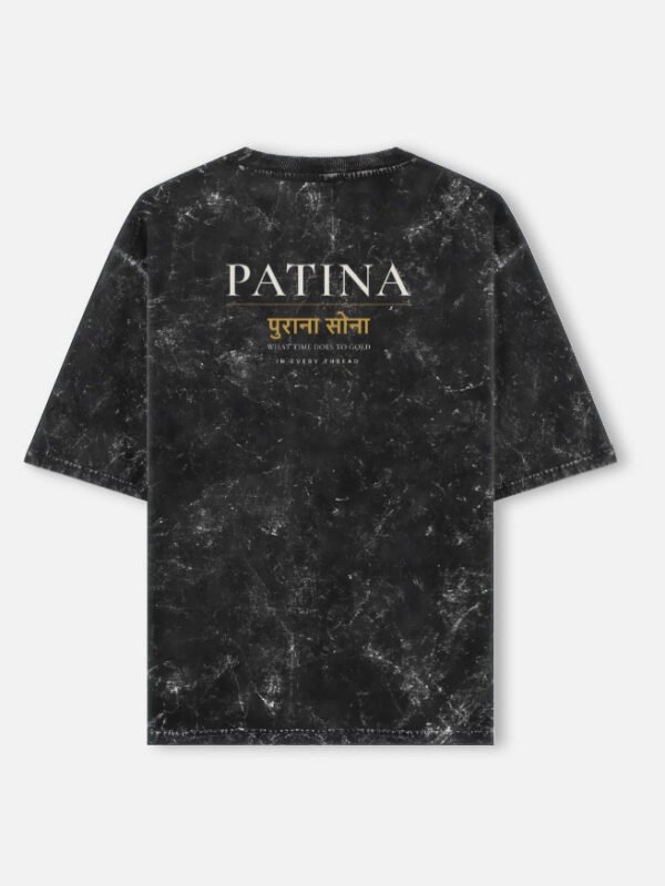 PATINA — Acid Wash Oversized Tee in black, back view with PATINA and the Hindi words purana sona across the upper back