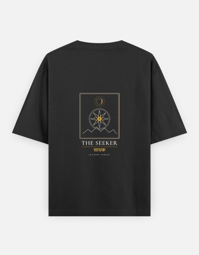 THE SEEKER — Oversized Tee in black, back view with the compass-star archetype card on the back
