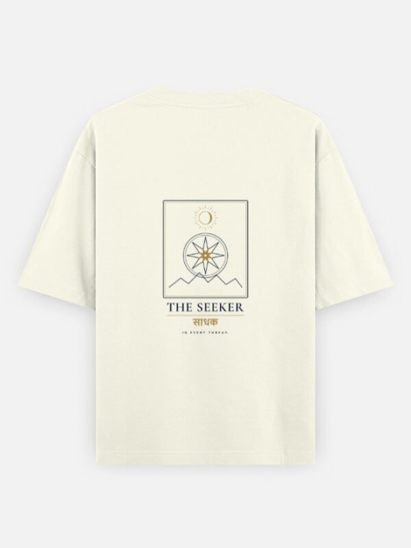 THE SEEKER — Oversized Tee in off white, back view with the compass-star archetype card on the back