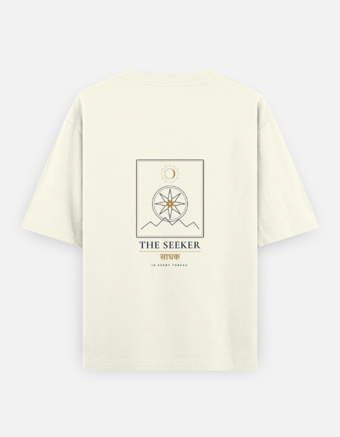 THE SEEKER — Oversized Tee in off white, back view with the compass-star archetype card on the back