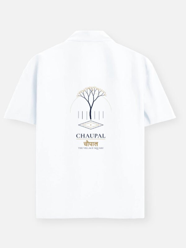 CHAUPAL — Oversized Shirt in white, back view with a banyan canopy over a village square