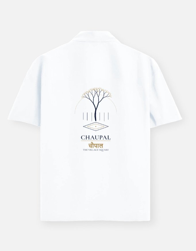 chaupal-oversized-shirt-white CHAUPAL — Oversized Shirt in white, back view with a banyan canopy over a village square