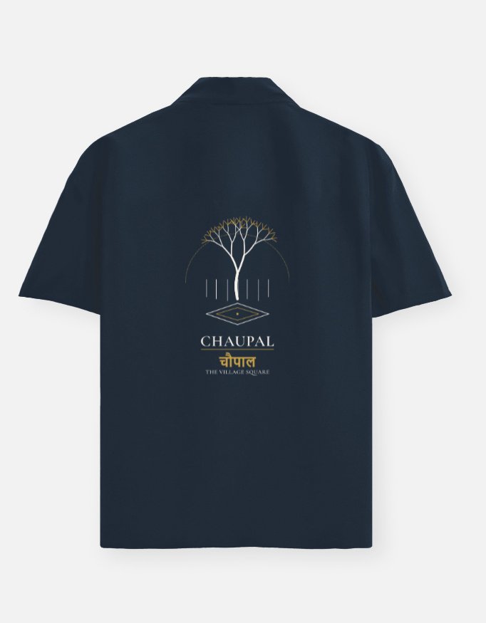 chaupal-oversized-shirt-navy-blue CHAUPAL — Oversized Shirt in navy blue, back view with a banyan canopy over a village square