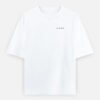IRAADA Devanagari Oversized Tee in white, front view with the LUXORIQ wordmark at the left chest