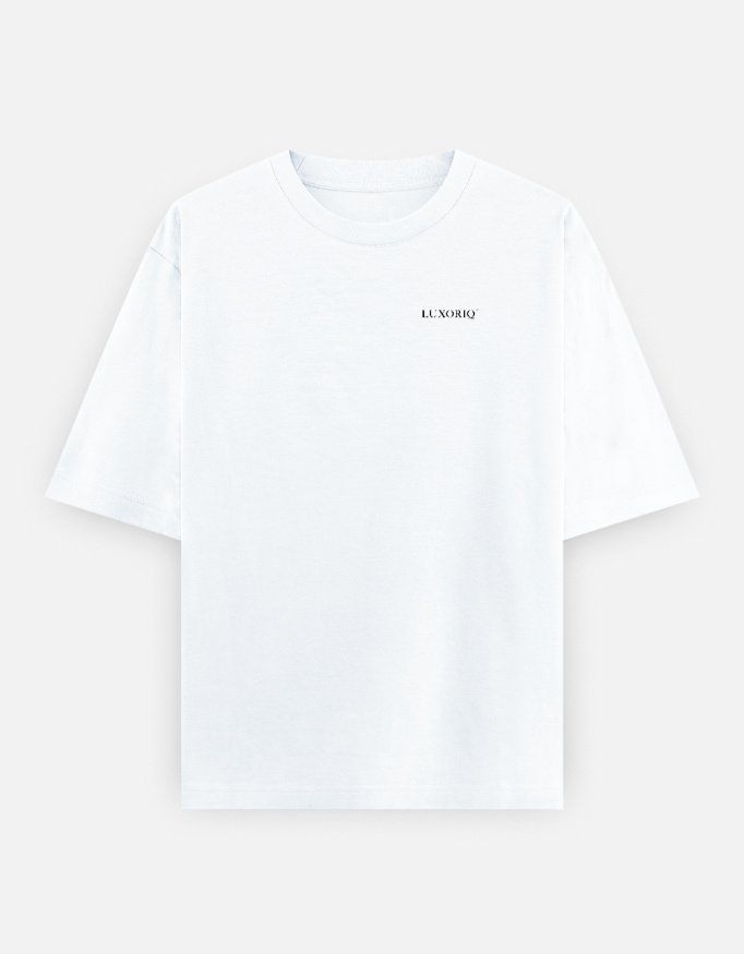 IRAADA Devanagari Oversized Tee in white, front view with the LUXORIQ wordmark at the left chest