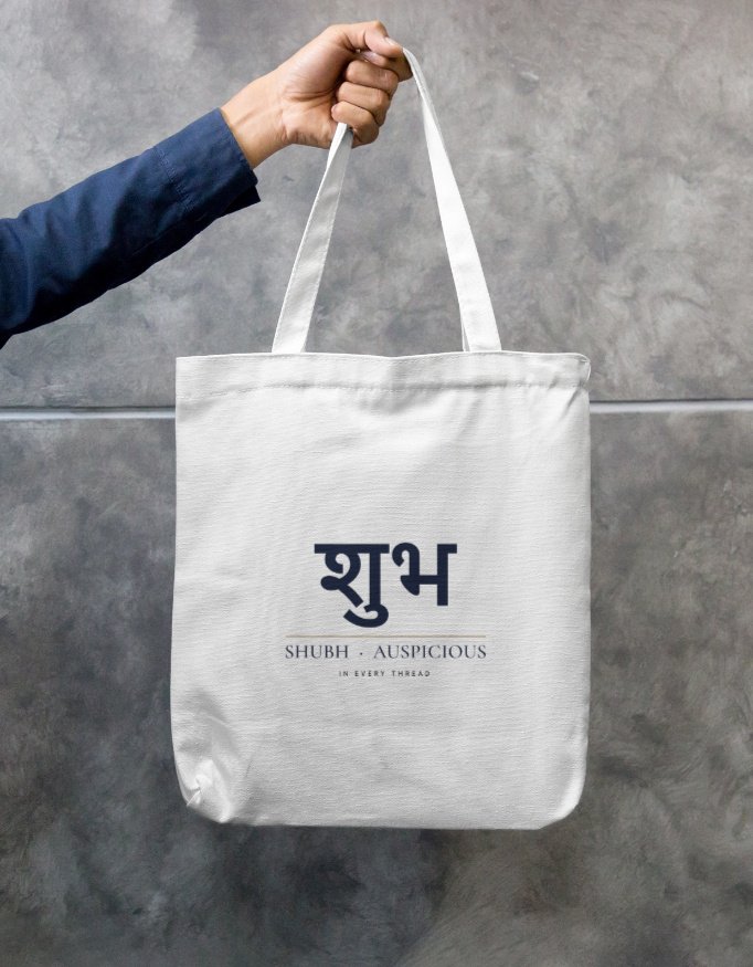 shubh-gifting-tote-white-front SHUBH — Gifting Tote in white, front view with the शुभ SHUBH · AUSPICIOUS print