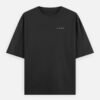 IRAADA Devanagari Oversized Tee in black, front view with the LUXORIQ wordmark at the left chest