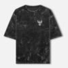 PATINA — Acid Wash Oversized Tee in black, front view with the LUXORIQ phoenix crest at the left chest