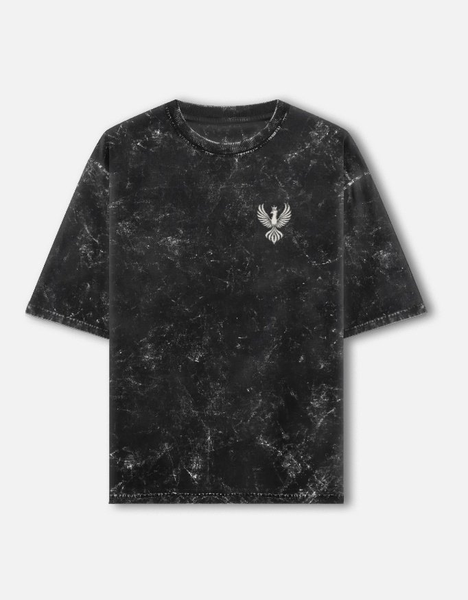 PATINA — Acid Wash Oversized Tee in black, front view with the LUXORIQ phoenix crest at the left chest
