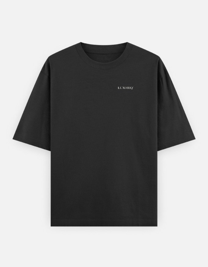 IRAADA Devanagari Oversized Tee in black, front view with the LUXORIQ wordmark at the left chest