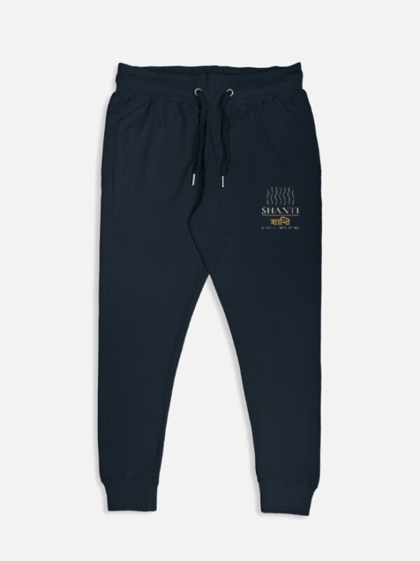 SHANTI — Mindful Movement Joggers in navy blue, left-leg print of wave lines, SHANTI and शान्ति