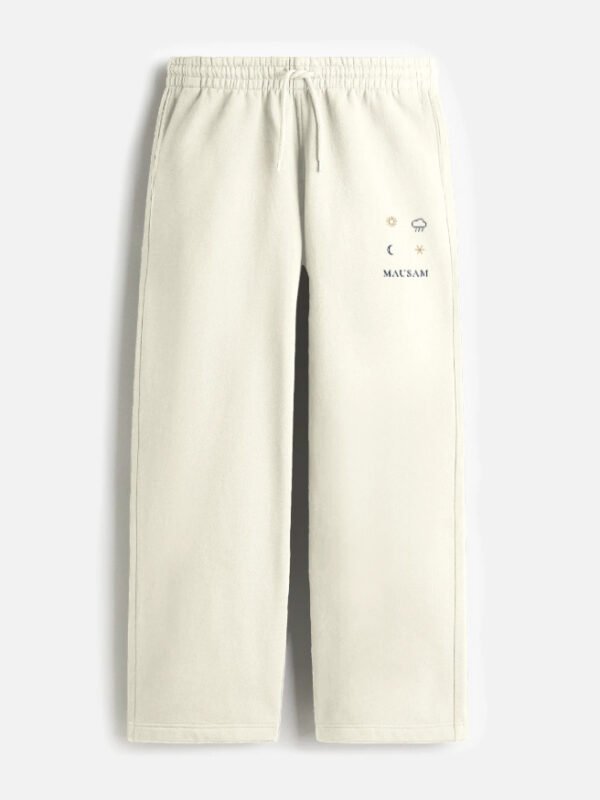 MAUSAM — Sweatpants in off white, four weather glyphs on the left thigh